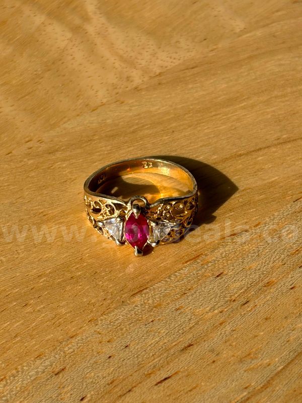 TiDDRs: 10K Gold Marquise-cut Ruby & CZ Ring size 6.25. Evaluated by a jeweler.