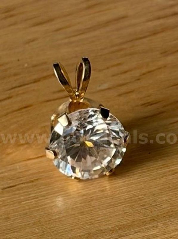 TiDDRs: 14K Gold Pendant w/ cubic zirconia. Confirmed by jeweler.