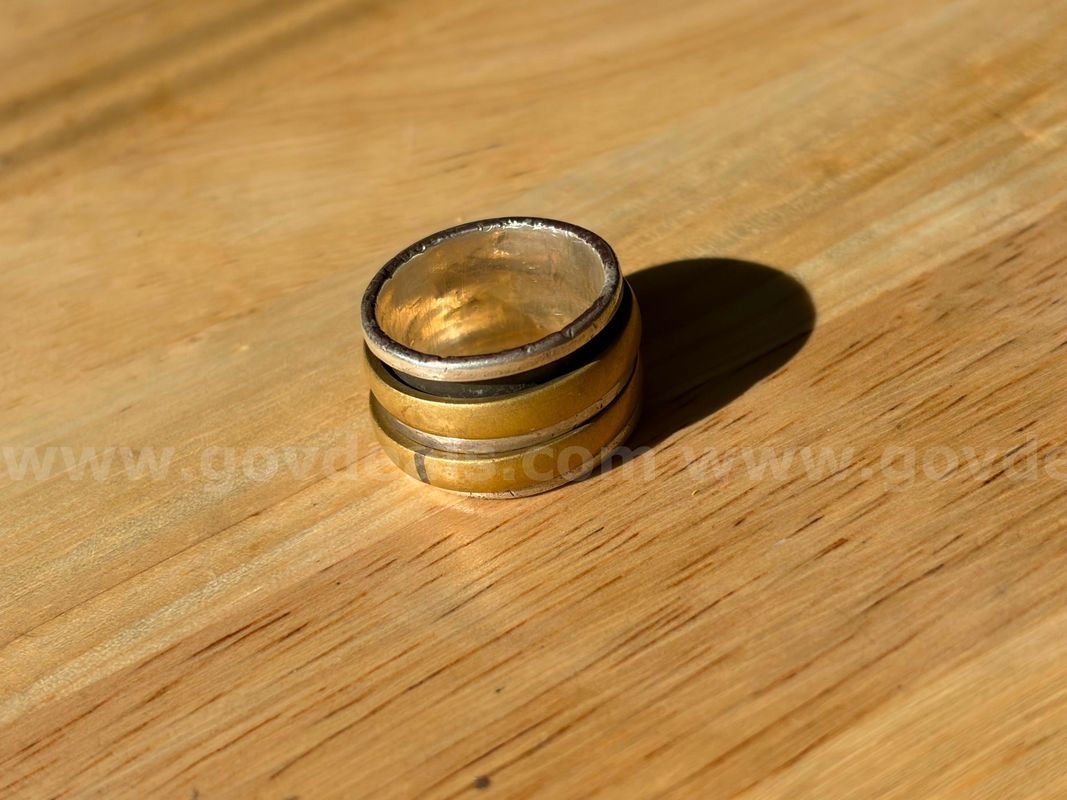 TiDDRs: A Wide 925 Sterling Silver and Brass Spinner Ring, size 8.25