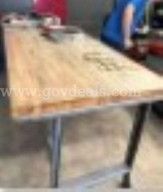 Industrial workbench Heavy-duty featuring a thick, edge-grain wooden butcher block