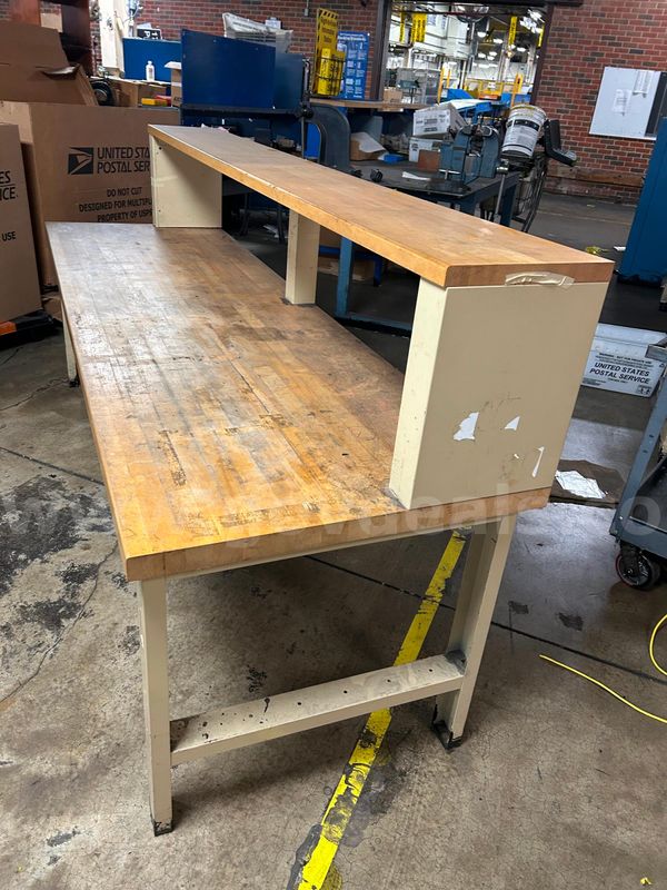 Industrial workbench with a thick butcher block/hardwood