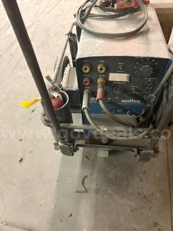 Miller Roughneck 2E engine-driven portable welder and AC generator mounted on a metal cart
