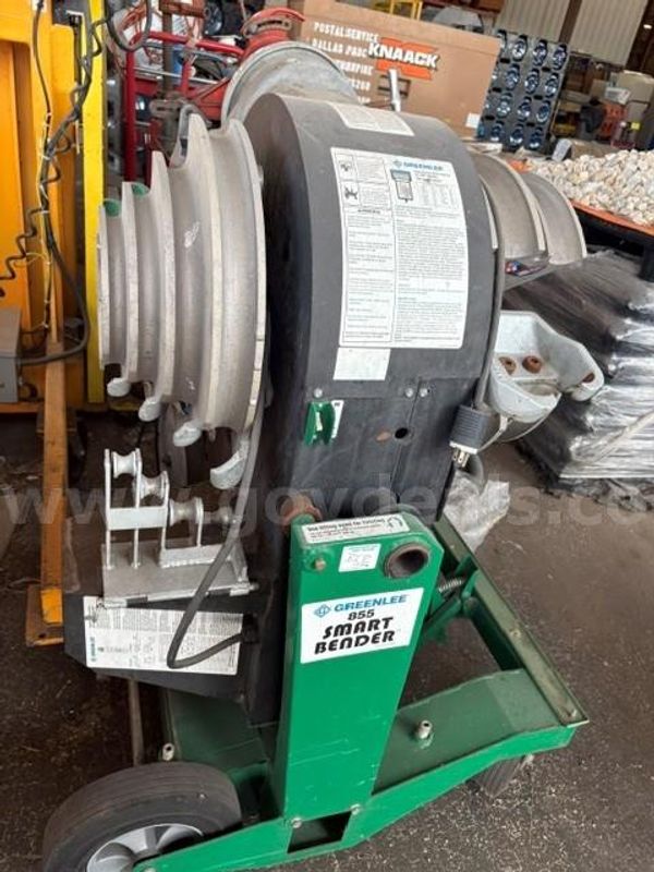 Greenlee 855 Smart Bender, an electric conduit pipe bender mounted on a green transport cart