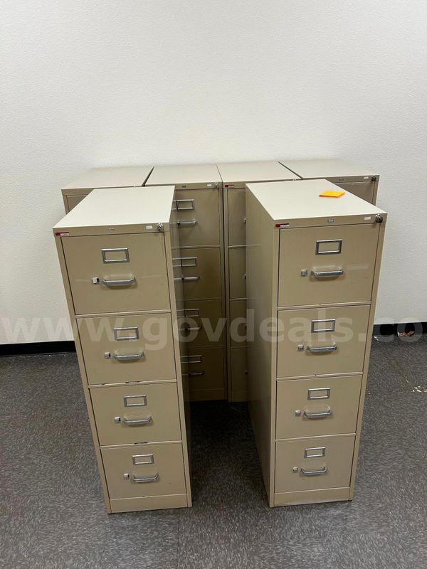 Six  4-drawer metal filing cabinets