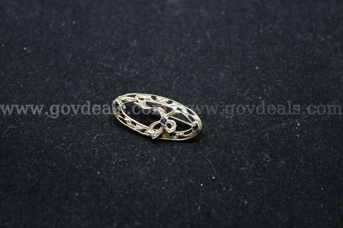 1- Silver Colored Brooch With Multiple Colored Stones