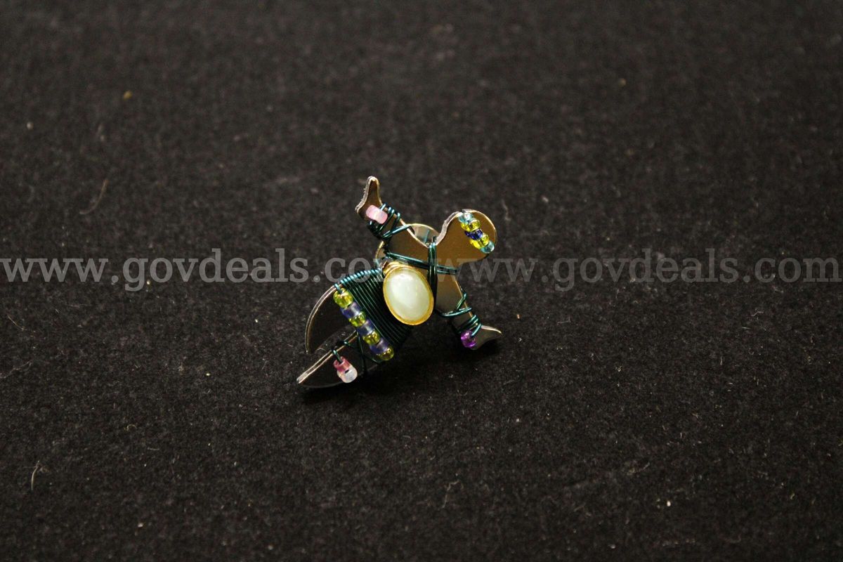 1- Silver Colored Pin With Multiple Colored Beads And A White Stone