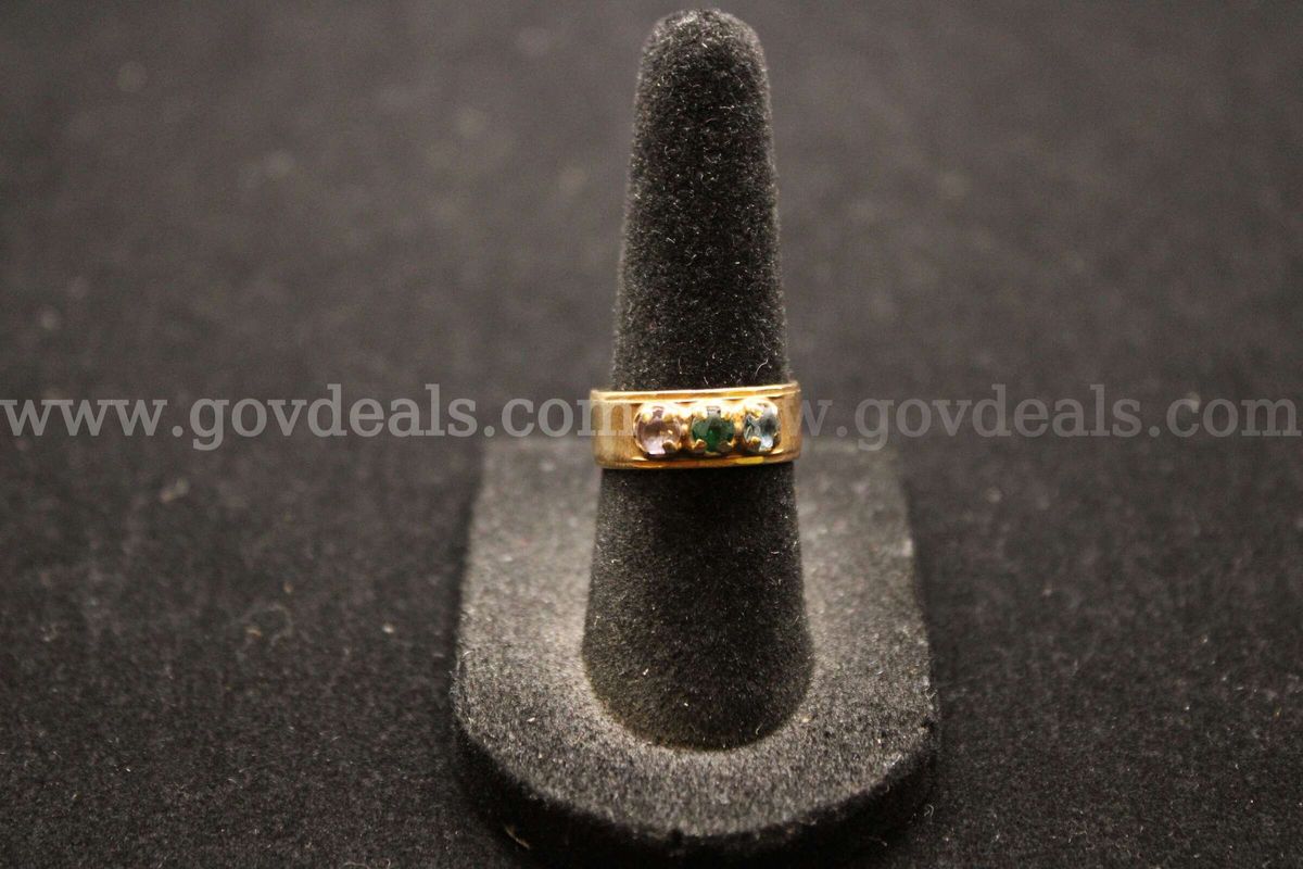 1- Gold Colored Ring With Multiple Colored Stones And A Clear Stone