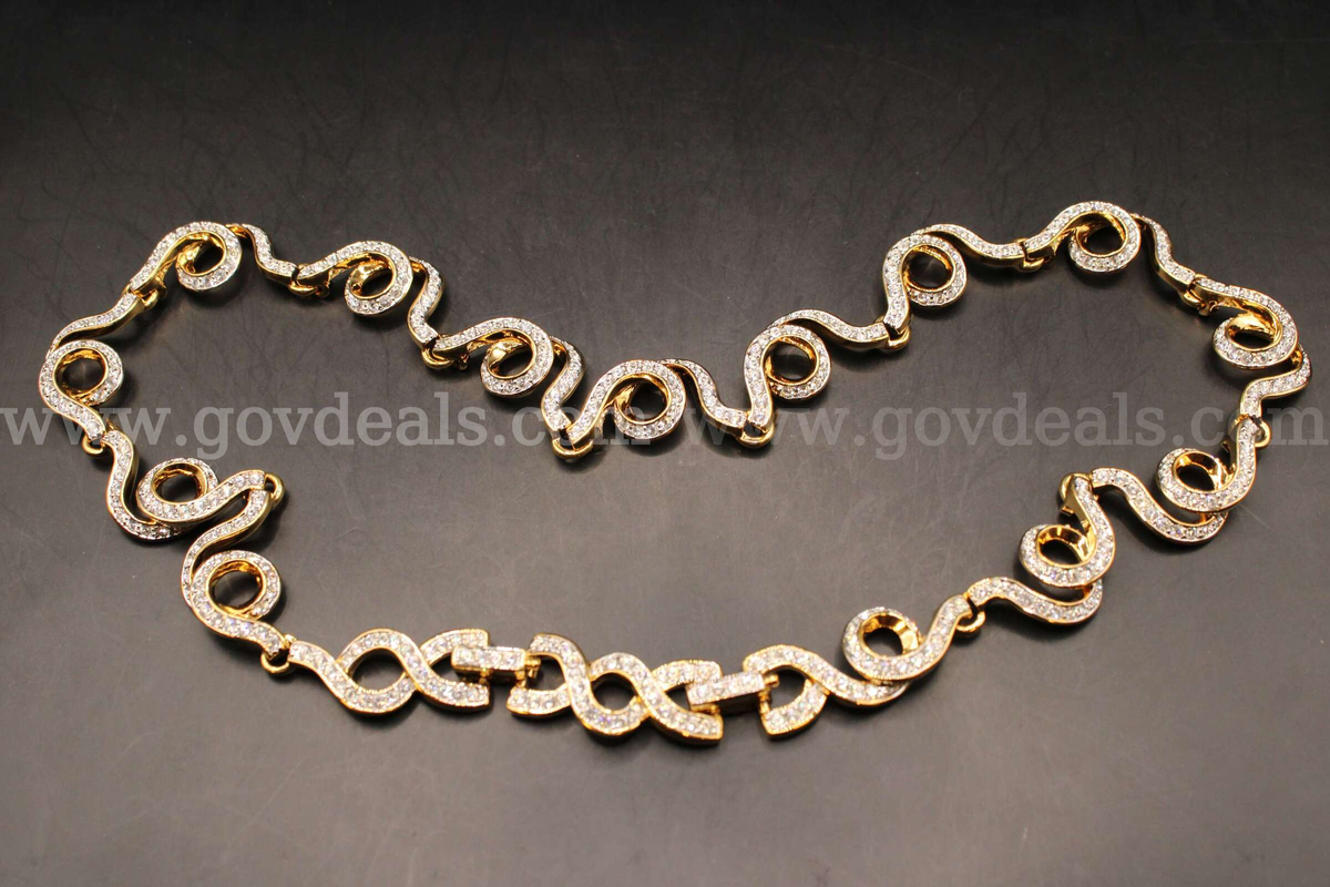 1- Gold Colored Necklace With Multiple Clear Stones
