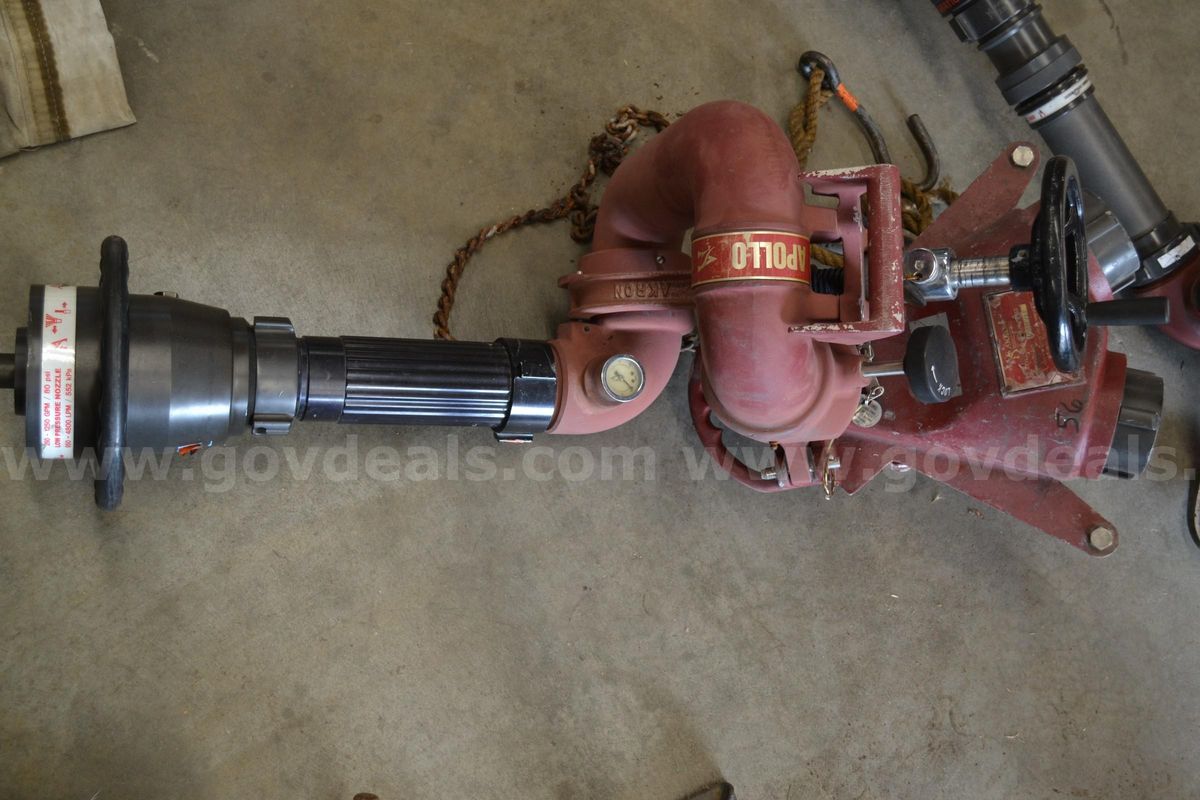 Lot to include One Akron Deck Gun, Ground Base, Stream Shaper, and Fog Nozzle