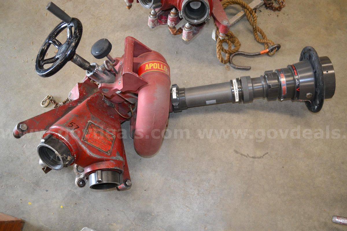 Lot to include One Akron Deck Gun, Ground Base, Stream Shaper, and Fog Nozzle