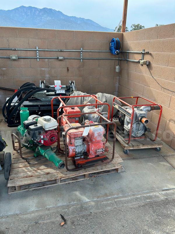 Lot of 4 used trash pumps and 1 used portable generator
