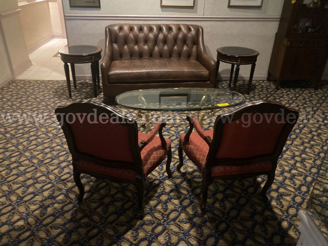 Lot of 2 padded chairs, leather sofa, 2 round end tables, glass oval table