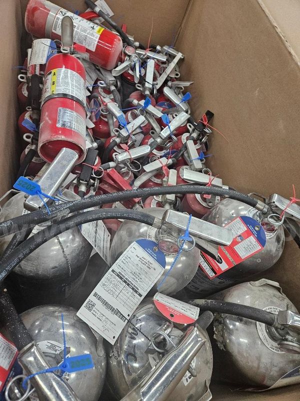 Fire Extinguishers various sizes and colors for auction. Sold As Is. Total 75.