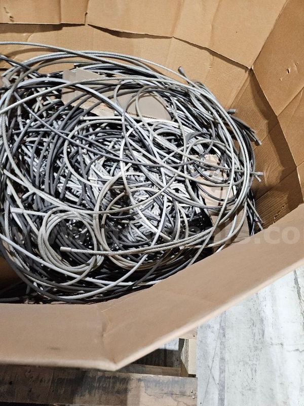 Approx. 125 Loose Security Cables in various colors. Sold As Is.