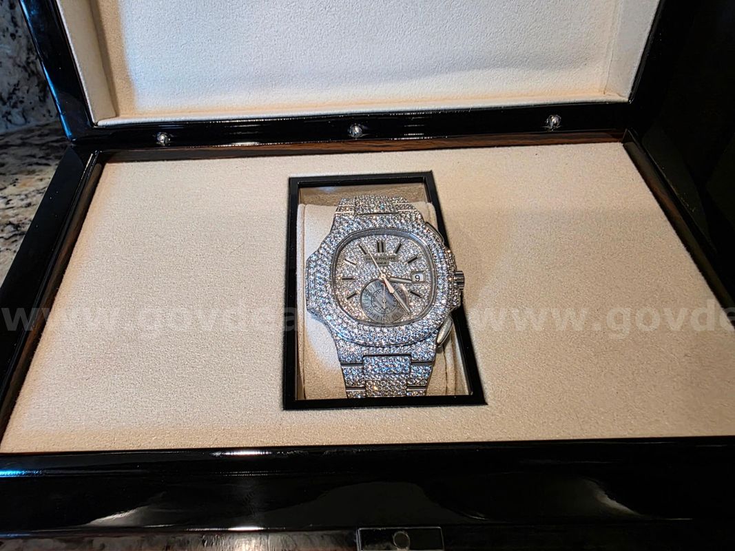 Stainless steel Patek Philippe Nautilus automatic watch; Aftermarket pave diamonds;40mm case; Stainless Bracelet.
