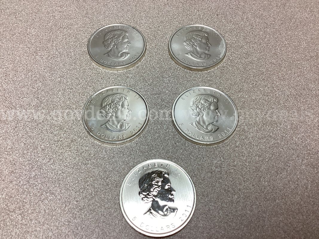 5 Troy ounces of 999.9 Fine Silver ( 8 Dollar coins )
