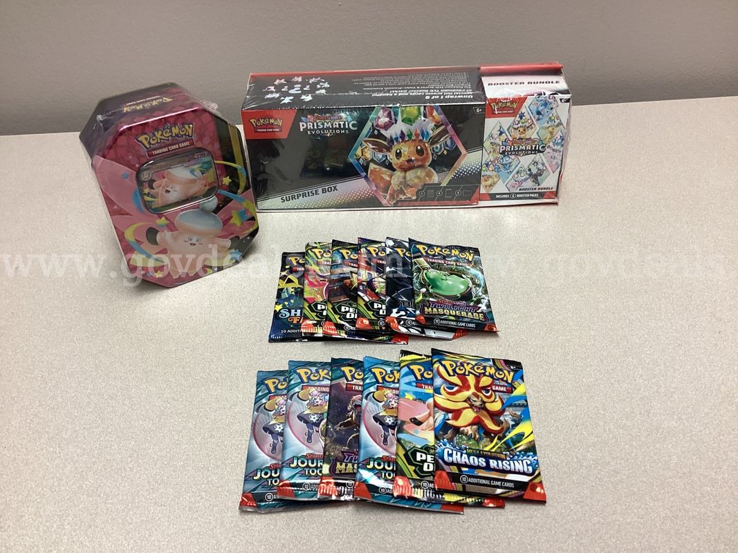 Scarlet & Violet Prismatic Evolutions Surprise Box 2-Pack, Mega Moonlit Tin and 12 Booster Packs