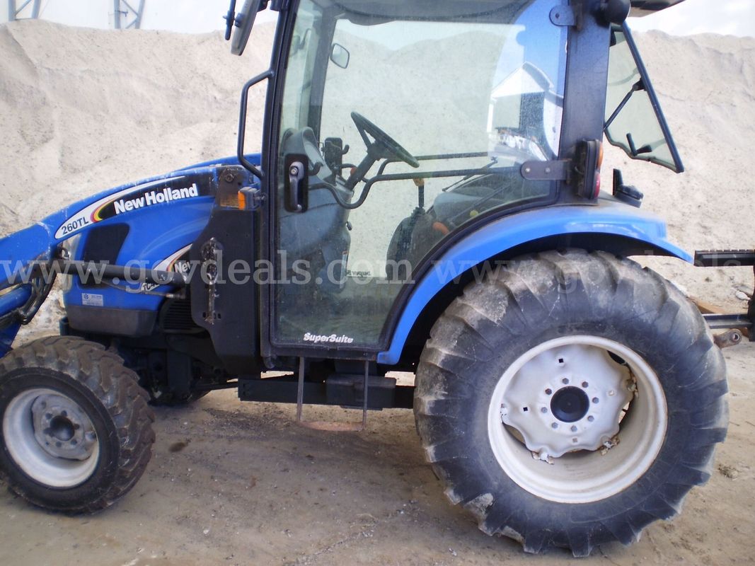 New Holland Tractor w/ Attachments