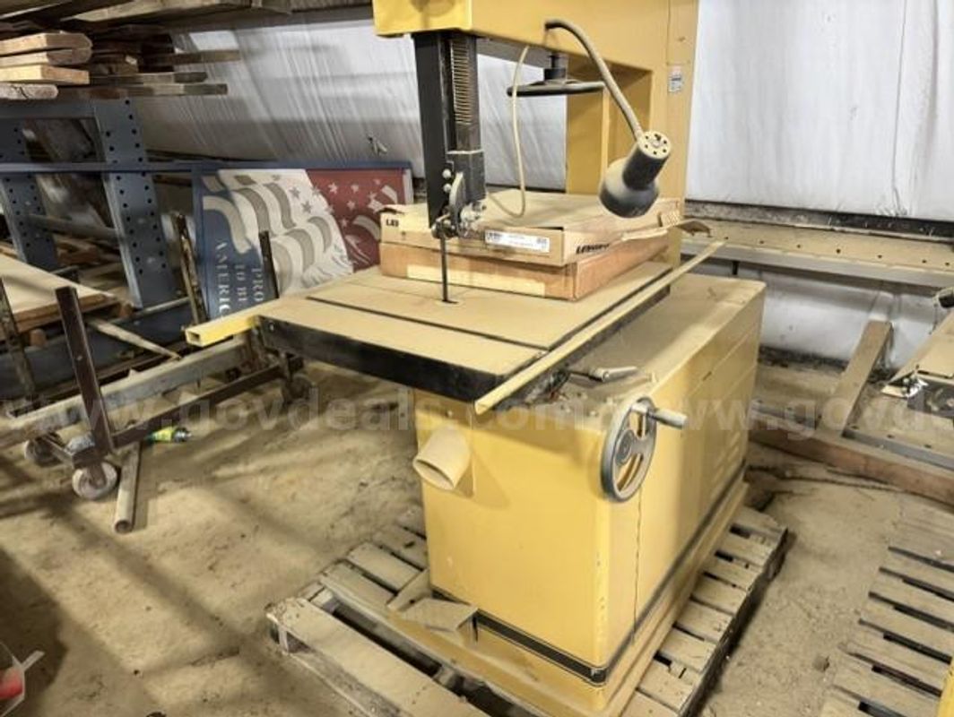Industrial Powermatic vertical band saw designed for cutting curves, irregular shapes, and resawing lumber. Heavy-duty s