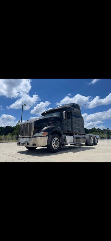 This black Peterbilt sleeper truck is set up as a full-size road tractor and is a solid candidate for an owner-operator,