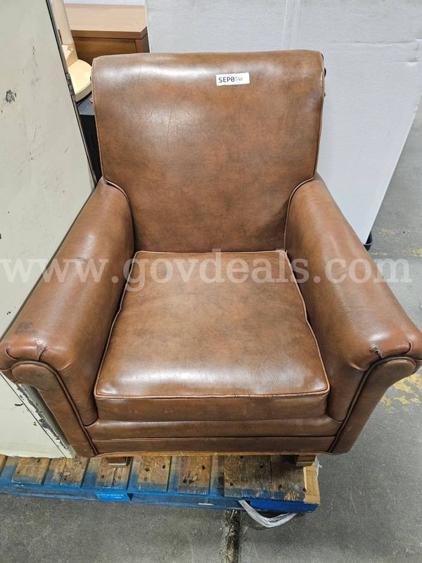 Brown leather club armchair