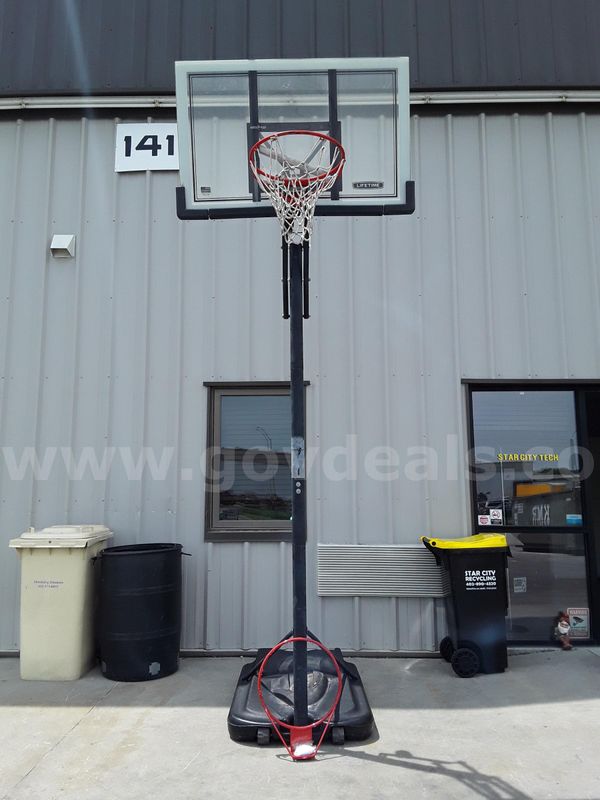 Adjustable basketball hoop (filled with sand) and replacement hoop/net