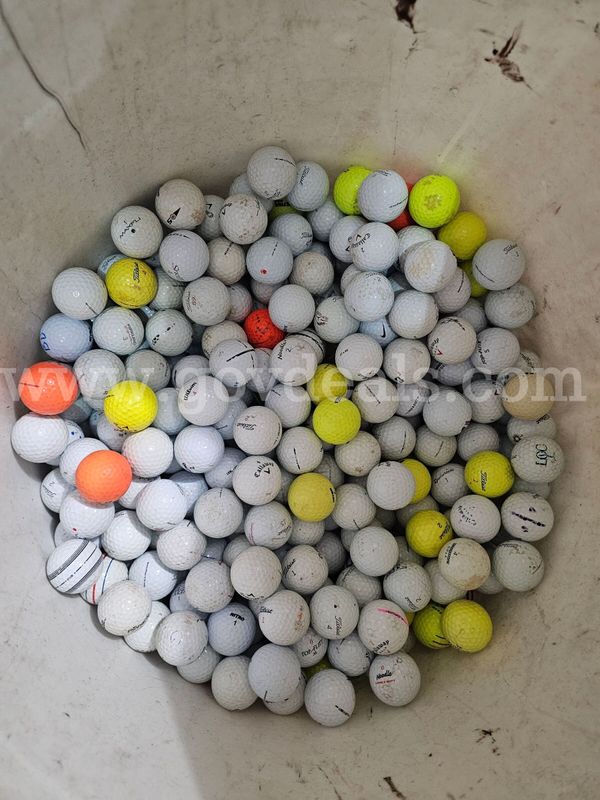 Barrel half full of golf balls