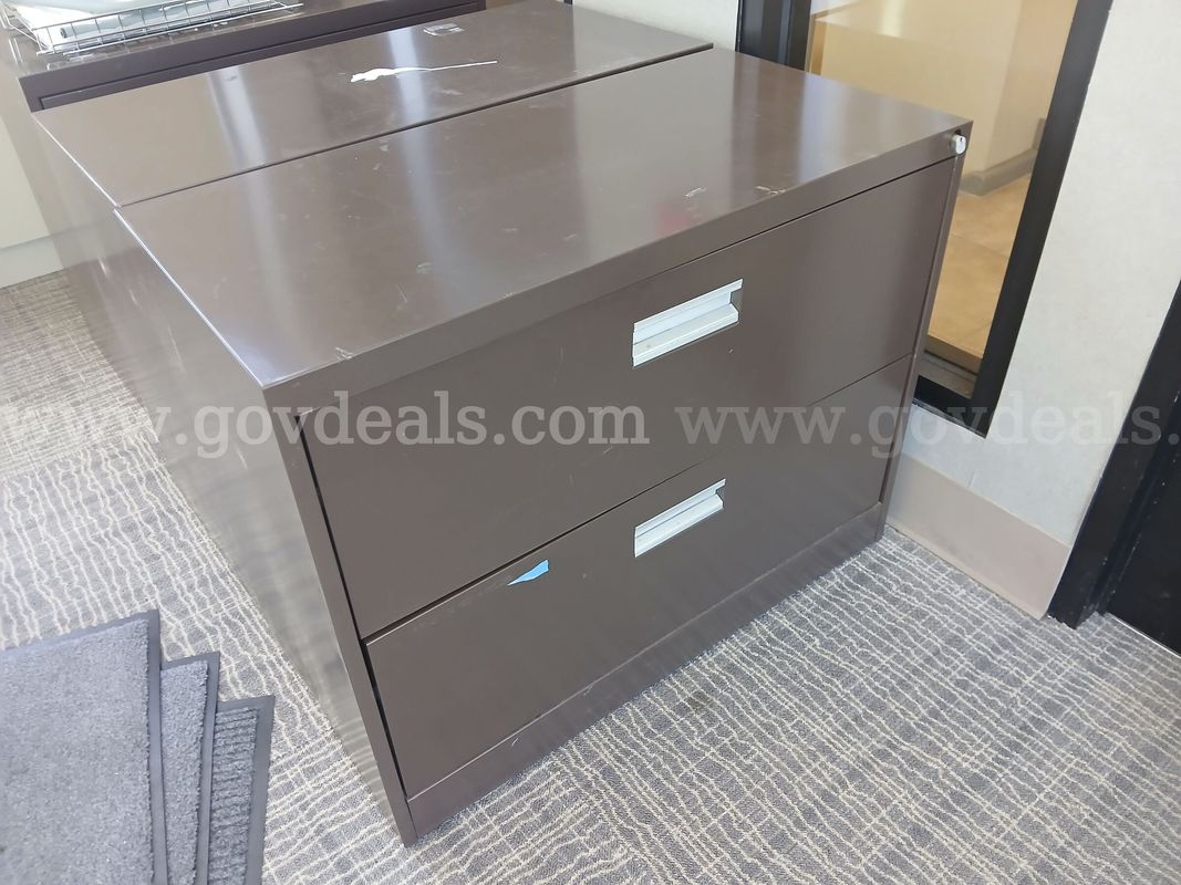 (1) Brown Lateral File Cabinet