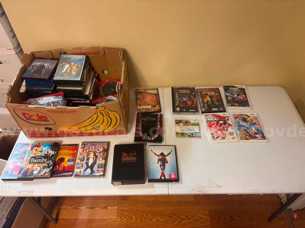An assortment of DVDs, CDs, and more.