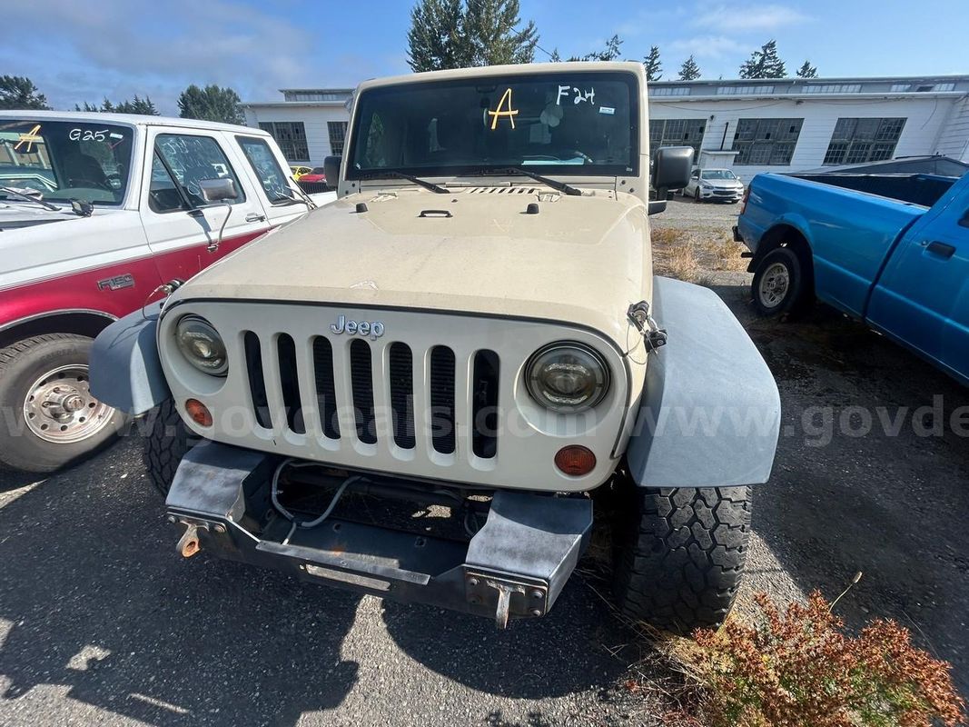 Tan 2012 Jeep Wrangler Sport 4WD