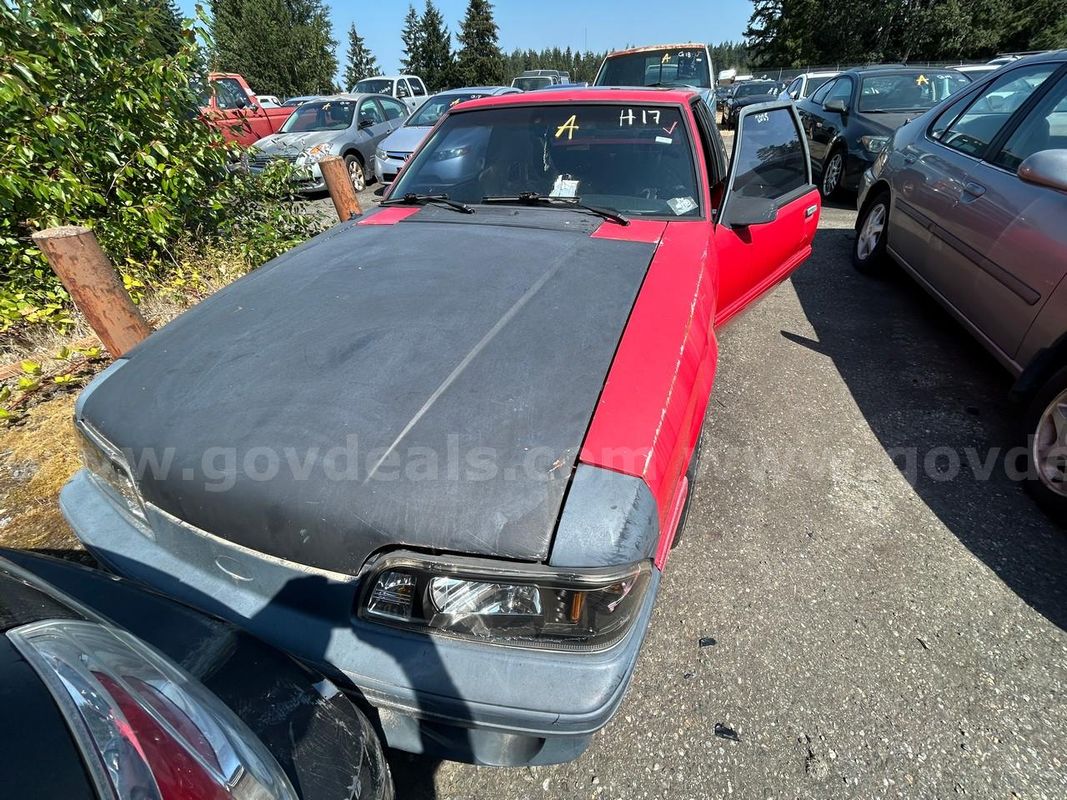 Red 1992 Ford Mustang LX 5.0L hatchback