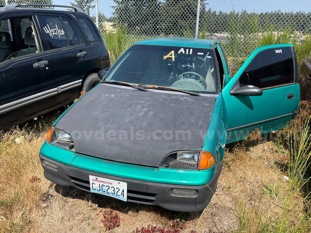 Green 1994 Geo Metro 2-Door hatchback