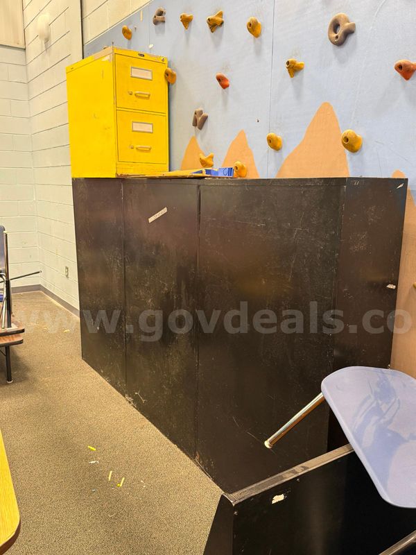 Three metal cabinets and one small filing cabinet