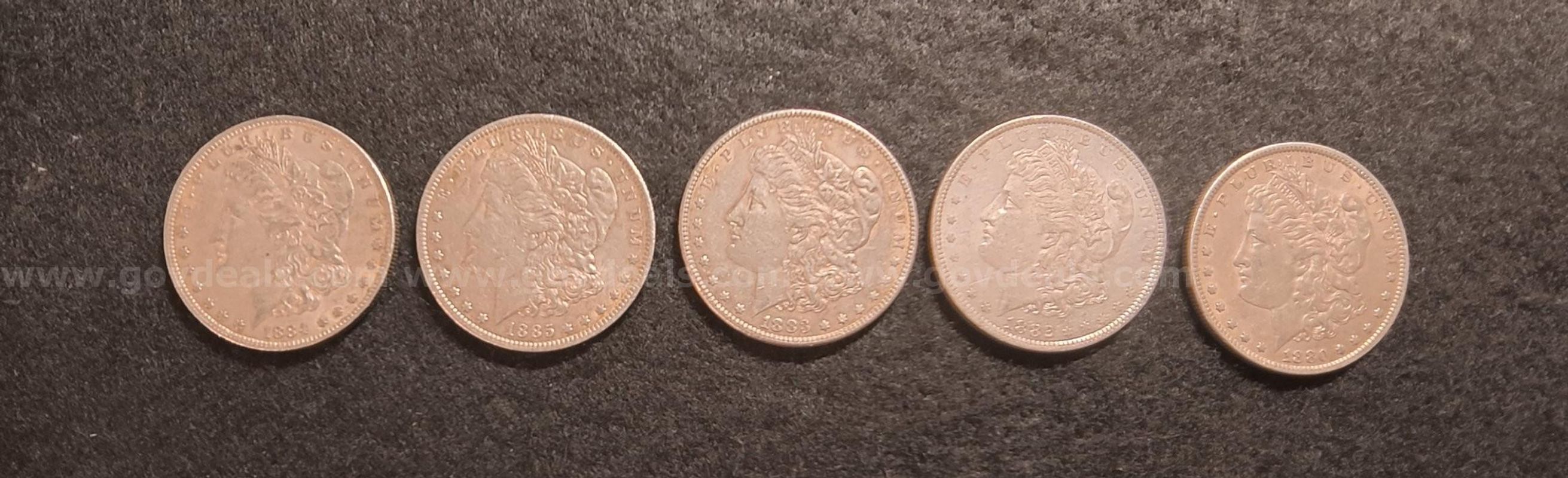Five New Orleans Mint Morgan Dollars all showing strong detail