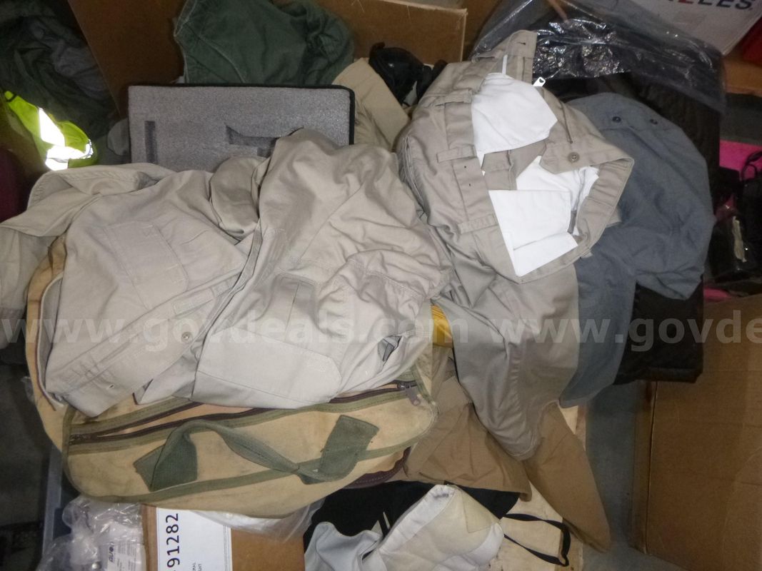 Large lot of items, pants, shirts, holsters, belts, shoes, various cases