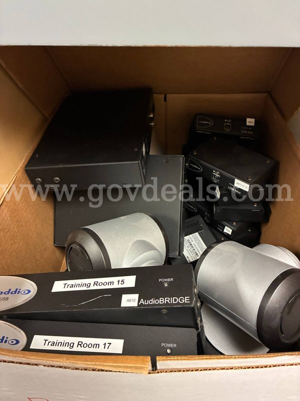 Misc. Conference Room Equipment, Poly Coms, Cameras, metal shelves, and cords.