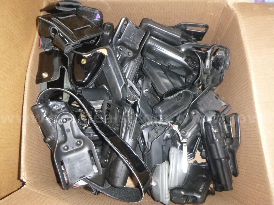 lot of old gear and holsters