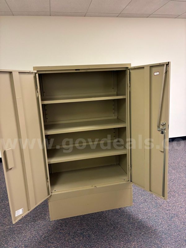 2 used 4 shelf cabinets