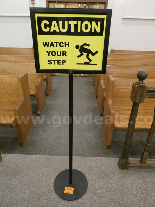 Sign ("Caution-Watch Your Step")