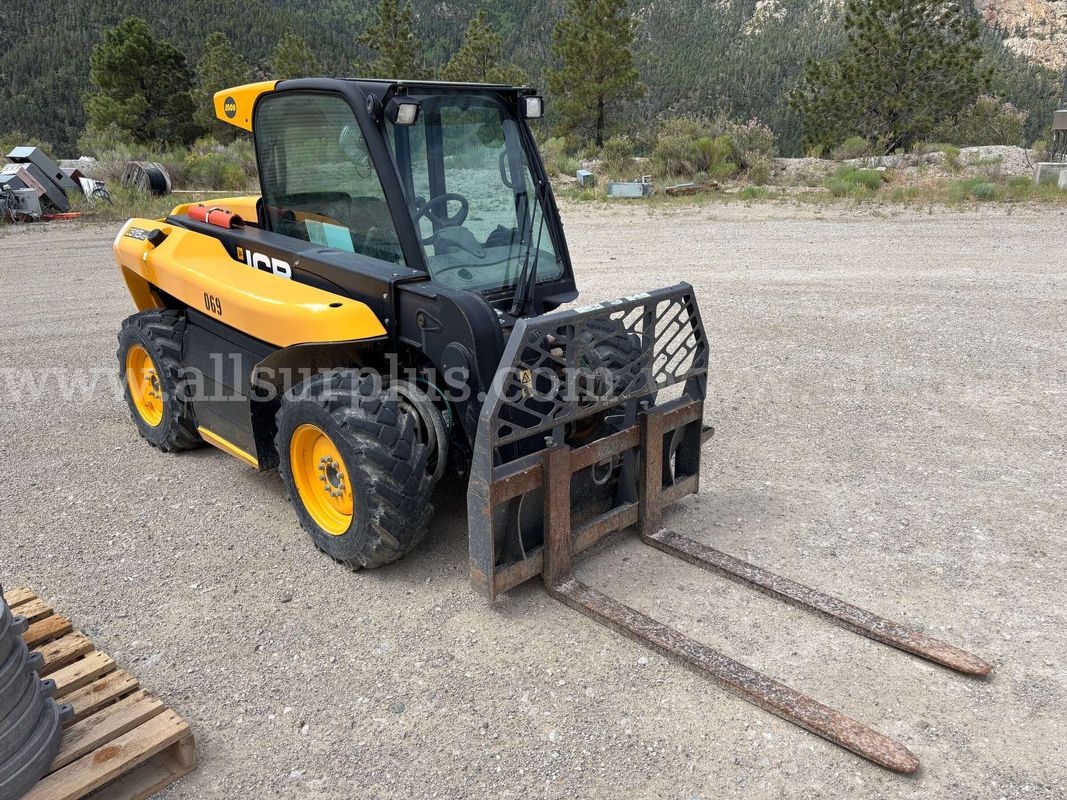 JCB 515-40 compact telehandler, with an enclosed cab, pallet forks.