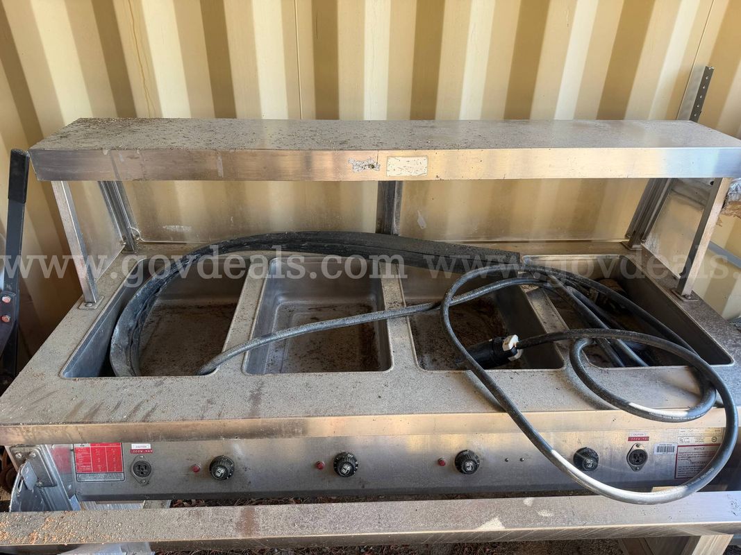 Servolift 4 well steam table with display table