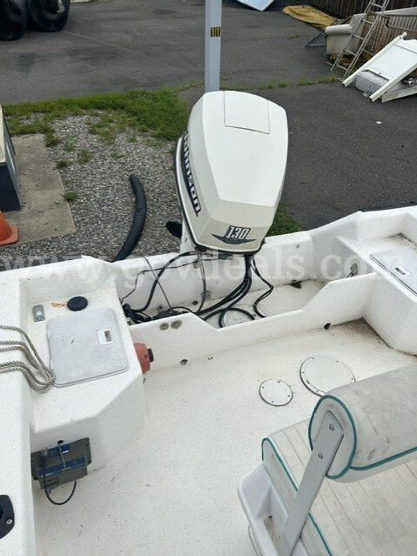 18' Fiberglass Key Largo Center Console with 4 stroke 130HP Johnson Outboard Motor and Load Rite Trailer