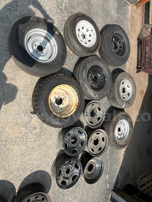 Lot of Surplus spare tires and wheels from trucks and trailers