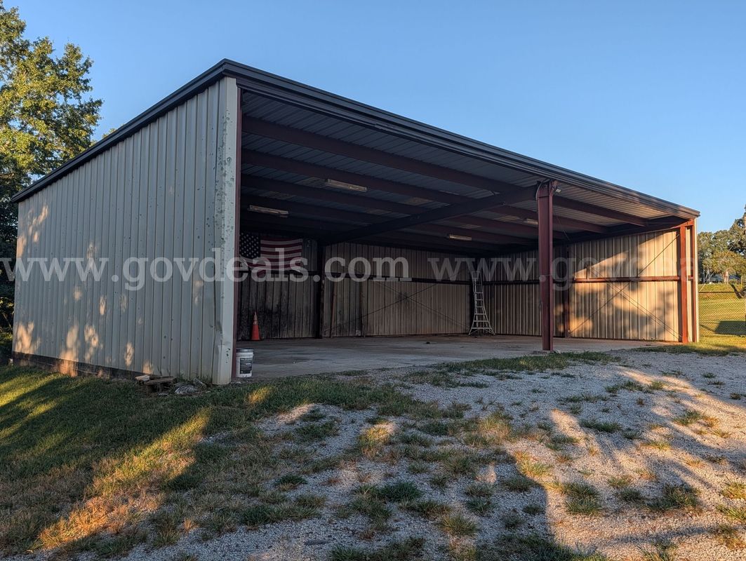Large 60' x 30' prefabricated metal building — excellent opportunity for equipment storage, agricultural use, workshop s