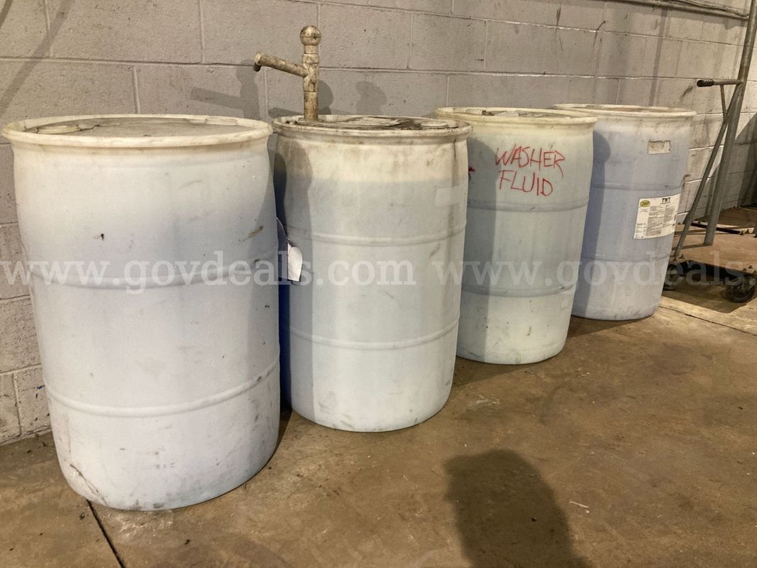 Lot of 4: 55gal plastic drum containing washer fluid and truck wash