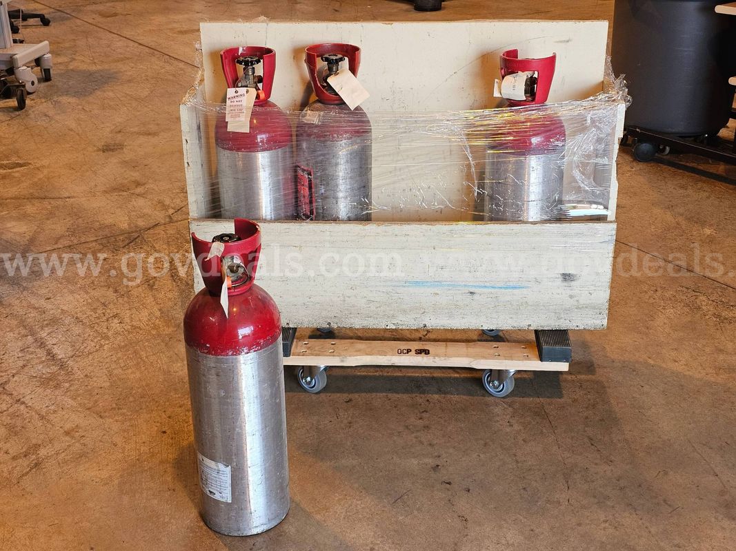 Lot of 4 - C02 CYLINDERS W/WOODEN STAND