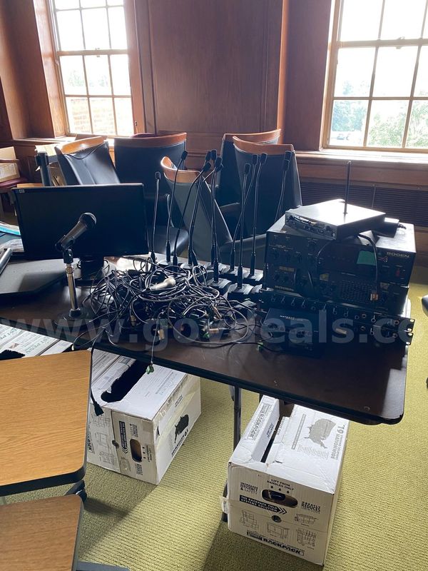Lot of assorted office computer monitors, wires, and printers