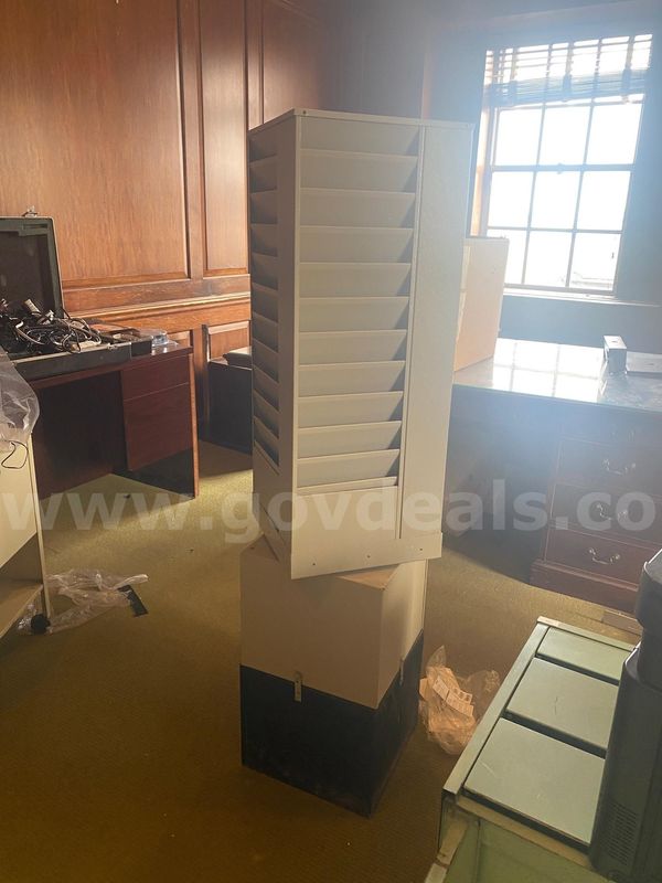 Lot of various filing cabinets and desks