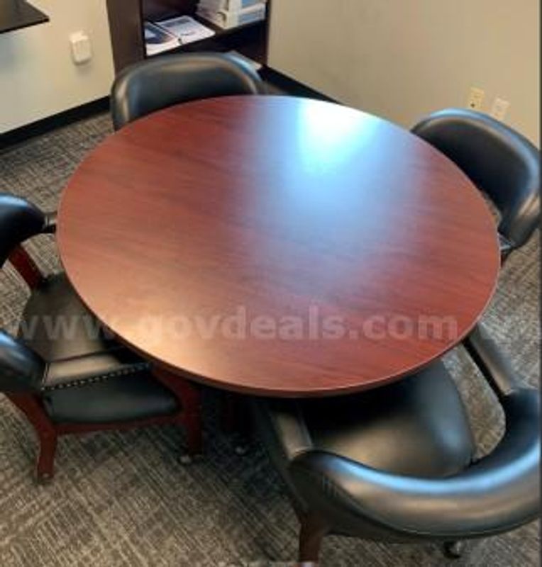 Table with 4 Black Cushioned Roller Chairs (1 of 2)