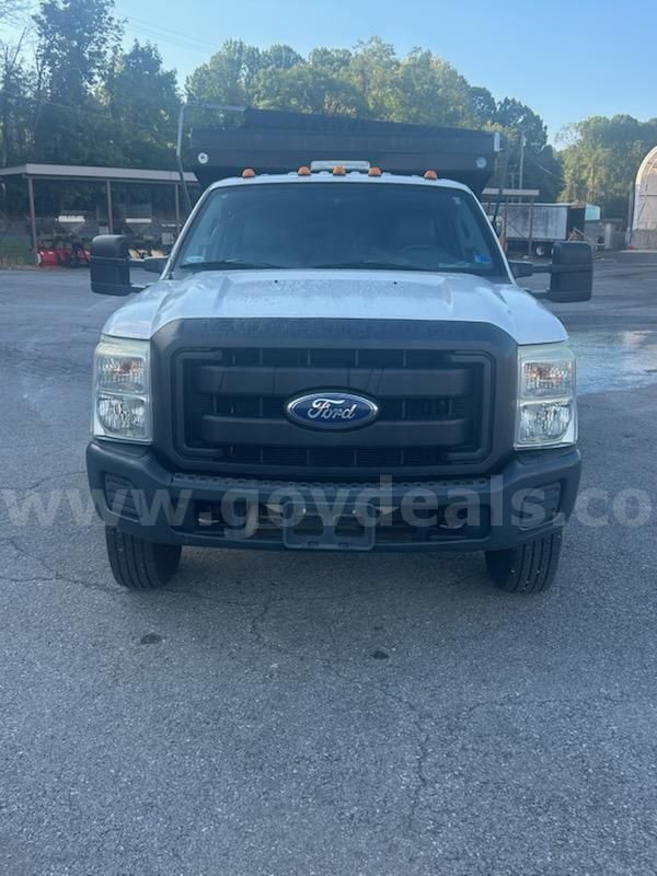 2011 Ford F-350 SD XL Crew Cab Long Bed DRW 4WD with dump bed.